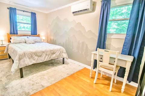 There are two bedrooms, each with a queen bed and separate mini-split temperature controls. Bedroom #2 includes a work area.