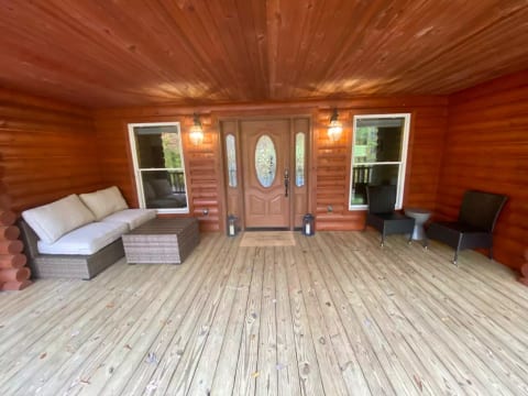 Huge front porch wraps around house