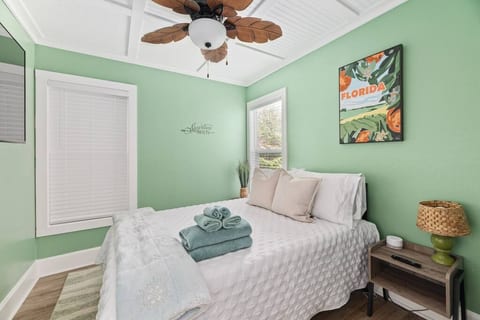 The second bedroom has a full (double) bed, a 55" TV, and a smaller closet than the master.