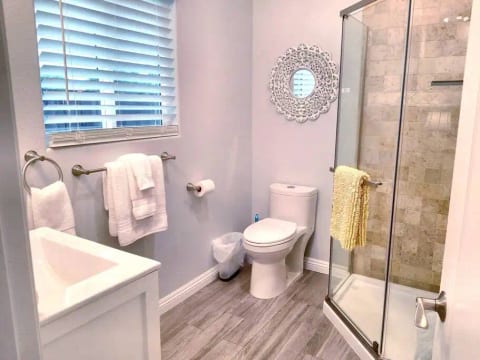 Spa Bathroom With Rain Shower and Travertine Walls