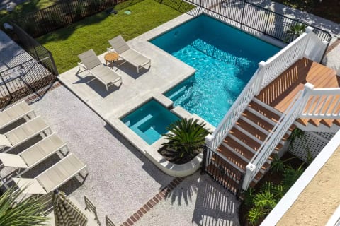Over head view of pool and hot tub from front porch
