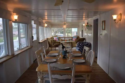Large sunroom for dining and hanging out (lots of windows to open for fresh air, but also air-conditioned and heated and with Dsimmable lights too