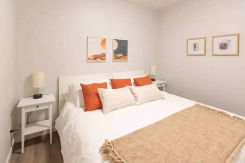 The second bedroom, like the master bedroom, features a comfortable king-sized bed. This interior bedroom is located right across the hall from the washroom.
Look for the USB plug-ins in the lamps.