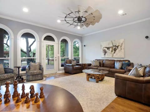 Bright living space with comfortable seating and access to the outdoor deck.