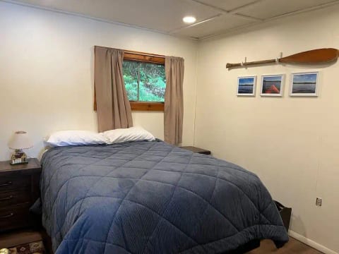 This bedroom has a queen sized bed with side tables with built in USB charging sockets.