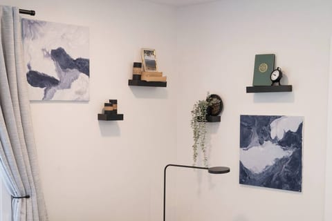 Thoughtful touches and tasteful decor are featured throughout the home. If you like any of the custom artwork, take it home! Prices are listed below.