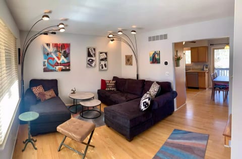 Main level living room, dining, kitchen beyond