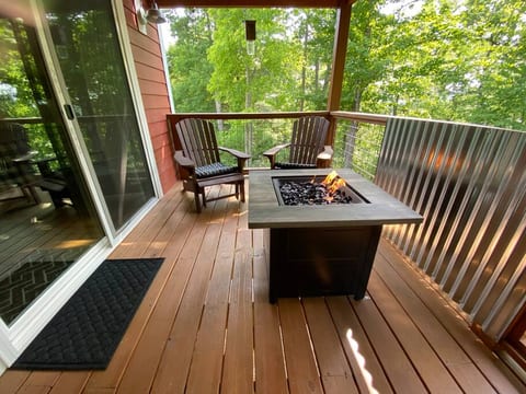 The rear porch also features a gas fire pit table for added ambience.