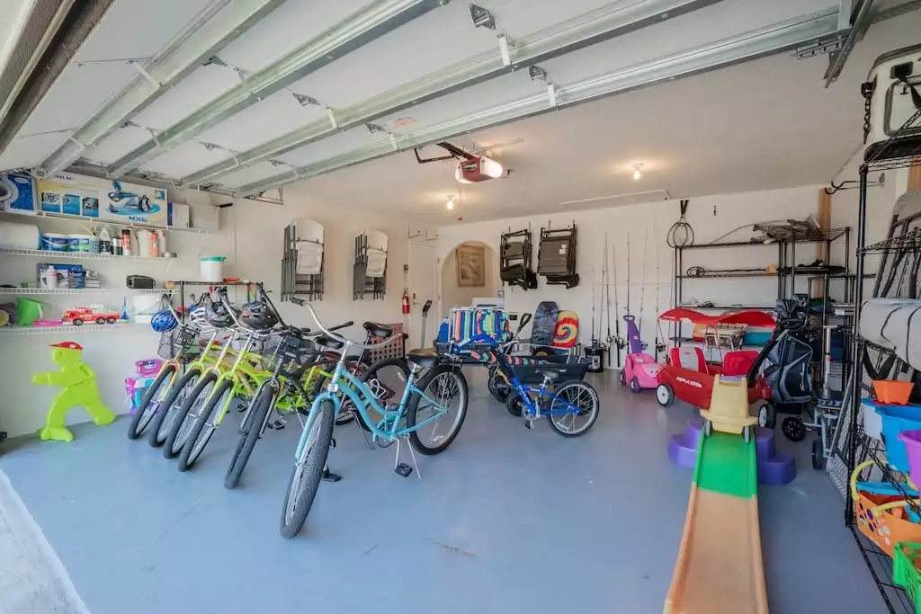 Garage with bikes, beach equipment beach toys.