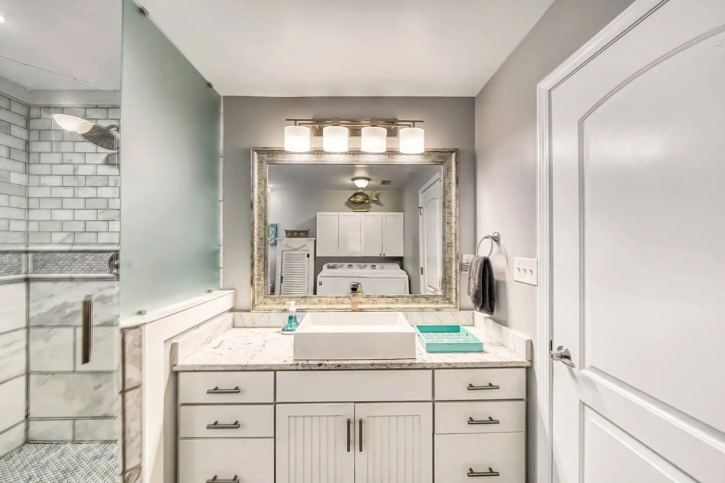 Downstairs bathroom #1, with large walk-in shower and laundry. Downstairs bathroom #1, with large walk-in shower and laundry. - The Curvy Palm - Panama City Beach