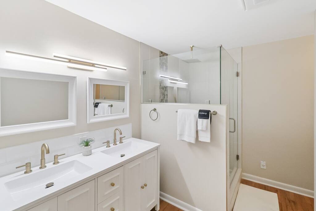 Master bathroom with double sink. - Modern Updated Executive Rental in Downtown RDU   - Raleigh