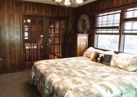 Bedroom showing the French doors out to the balcony above the living room.