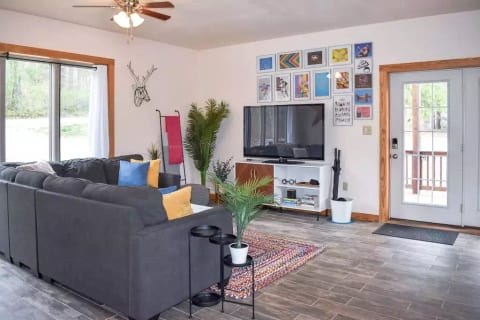 Sectional couch, perfect for cozying up to watch the 65" TV equipped with Roku