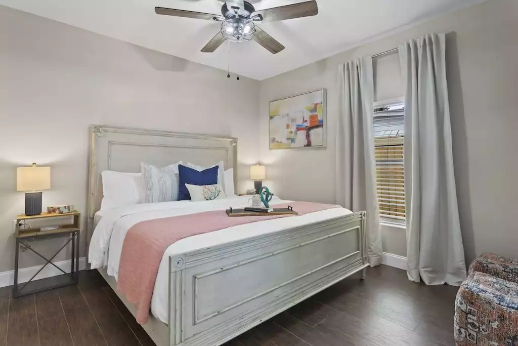 "Unwind in coastal comfort and midcentury style - our king bedroom suite is a true retreat. With luxury linens, an extra-large closet, and a private bathroom, it's the perfect oasis for your seaside getaway." "Unwind in coastal comfort and midcentury style - our king bedroom suite is a true retreat. With luxury linens, an extra-large closet, and a private bathroom, it's the perfect oasis for your seaside getaway." - NEW Gulfport Cottage Near Beach! - Gulfport