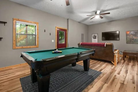 Lower floor with billiards table and movie/tv area