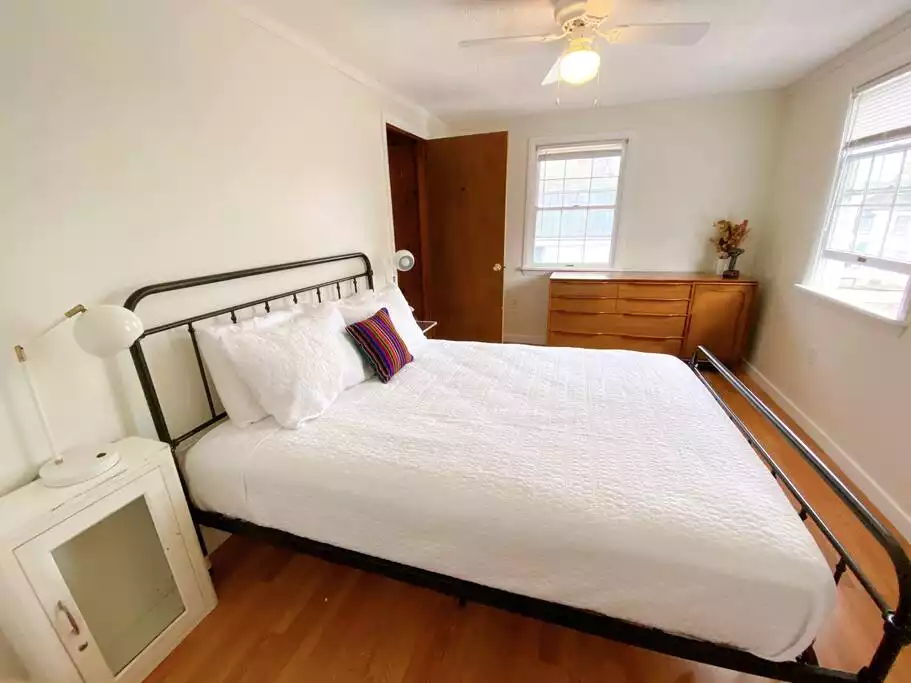 Primary bedroom with a queen bed - Ampersand House, right in Saranac Lake village - Saranac Lake