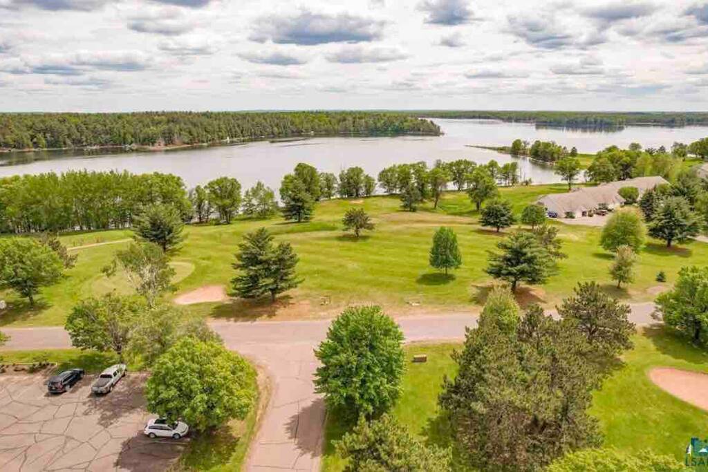 View to Birch Island Lake (recreational boating, boat launch, fishing and swimming available here). No overnight boat storage. - Northwoods WI: ATV, lake, pool, golf, hike, ski - Danbury