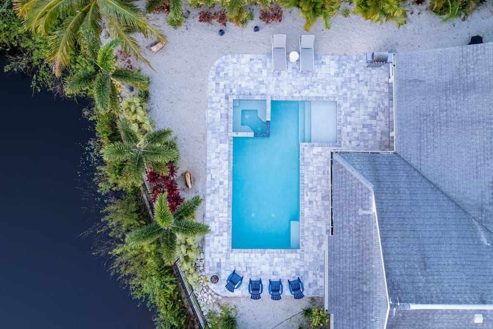 Aerial shot of house and pool.