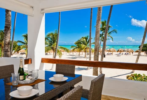 Gorgeous beachfront view from the very large deck. Enjoy the BBQ and dining area plus other seating areas for relaxing and entertaining. The Palapas and loungers on the beachfront are private and for guest's use only.