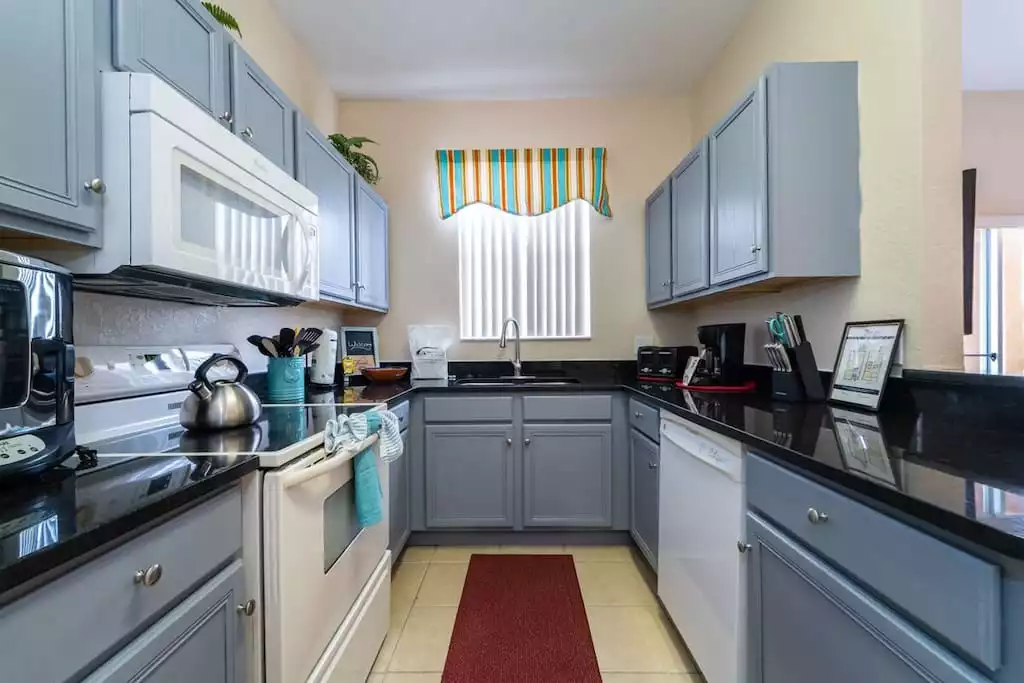 alternate view of kitchen - Regal palms home, gated community ,pool (712CAL) - Davenport