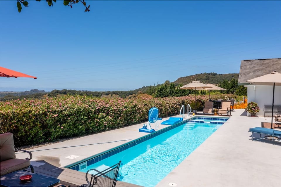 Soak in the California sun relaxing in this private heated 33 foot lap pool and hot tub.