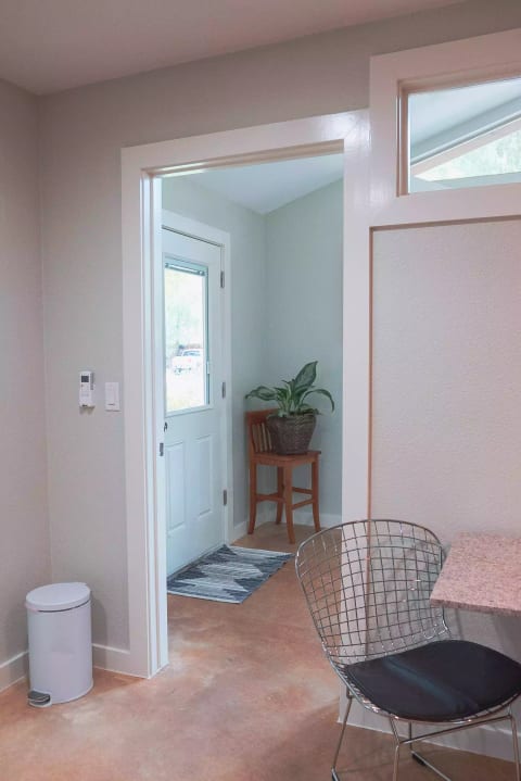 Private entry through a door with a code lock. The King size bed and the couch are separated by this wall