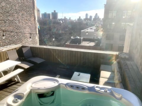 Private Roofdeck: Hot tub and lounge overlooking Tomkins Square Park (BBQ not visible in the corner)