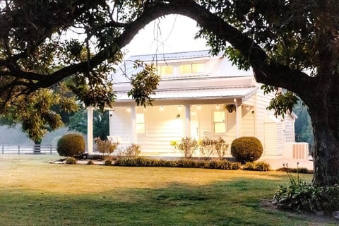 The Phoenix House as day breaks over the horizon behind the farm.