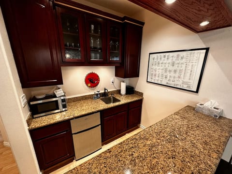 The bar and kitchenette are great for hanging out or can be used as a work area.