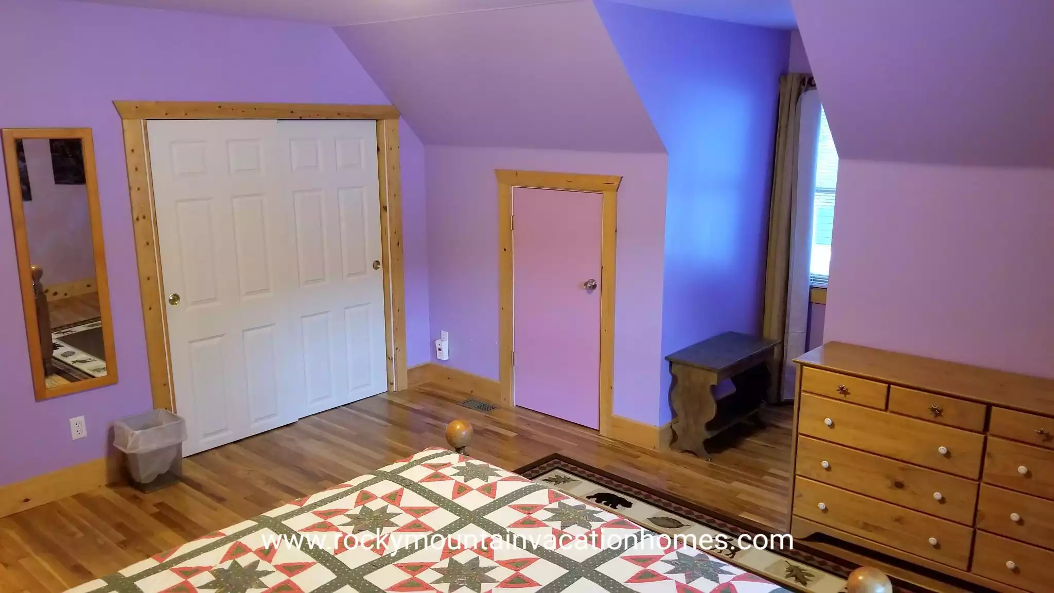 Purple Bedroom has a large closet as well as a storage space for your luggage