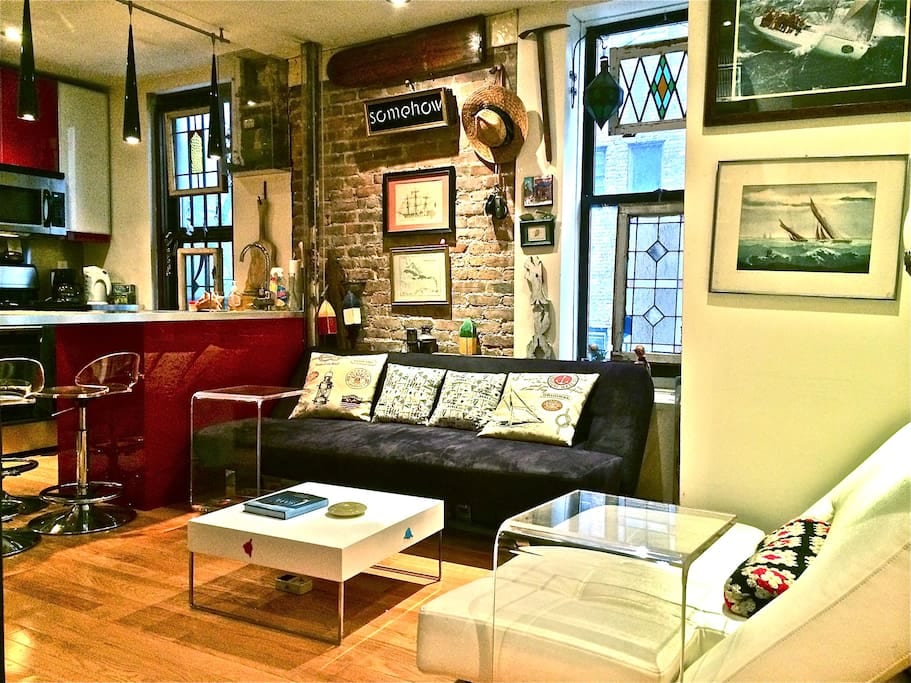 Living area and kitchen with island. This couch is also a fold out sleeper for additional guests