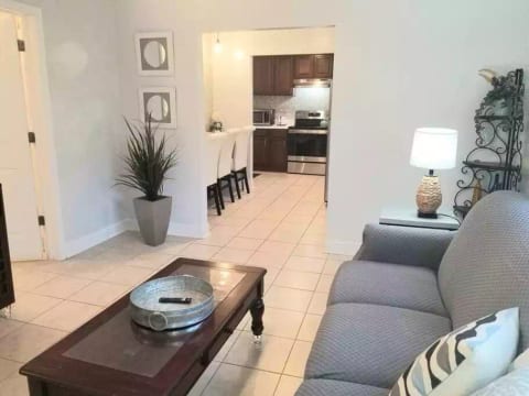 The living room, with view of the dining area & kitchen.