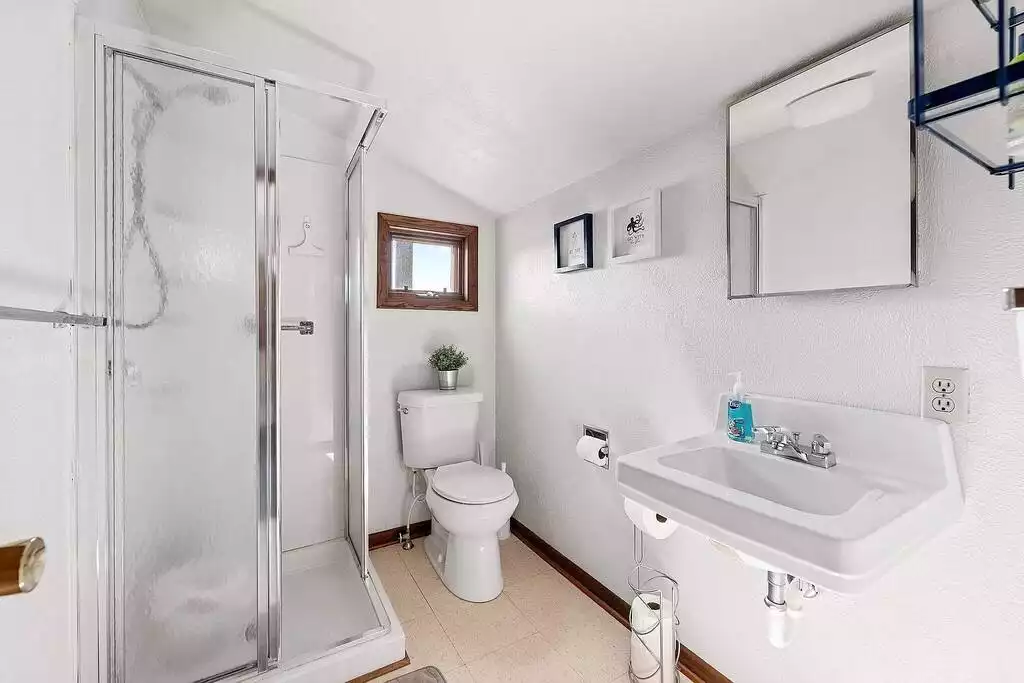 2nd floor bathroom with a standing shower. - Waterfront Vintage Chalet|Boats|Kayaks|Retro Games - Gaylord