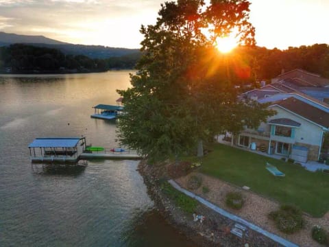 The dock is very easy to access and uncrowded. The side lawn, shown with the hammock, has plenty of room for the corn hole, or a game of badminton, and provides a level of privacy not found at any other rental.