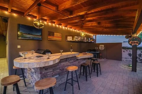 We call this area "Margaritaville".  Perfect for watching your favorite sports. Enjoy grilling on both the Gas BBQ grill and Treager smoker grill.
