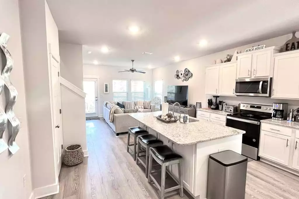 Spacious kitchen with large island to enjoy a quick meal! - Perdido Retreat - Modern Luxury near Beaches! - Perdido Key