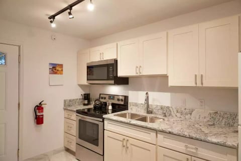 Glass top range, microwave w/exhaust fan.