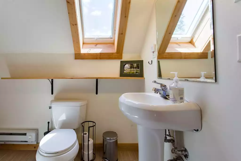 The complete 2nd floor bathroom has a shower stall and a pedestal sink. The sky light affords of starry nights. The complete 2nd floor bathroom has a shower stall and a pedestal sink. The sky light affords of starry nights. - MOUNTAIN SKI CHALET | INCREDIBLE CATSKILLS VIEWS - Prattsville
