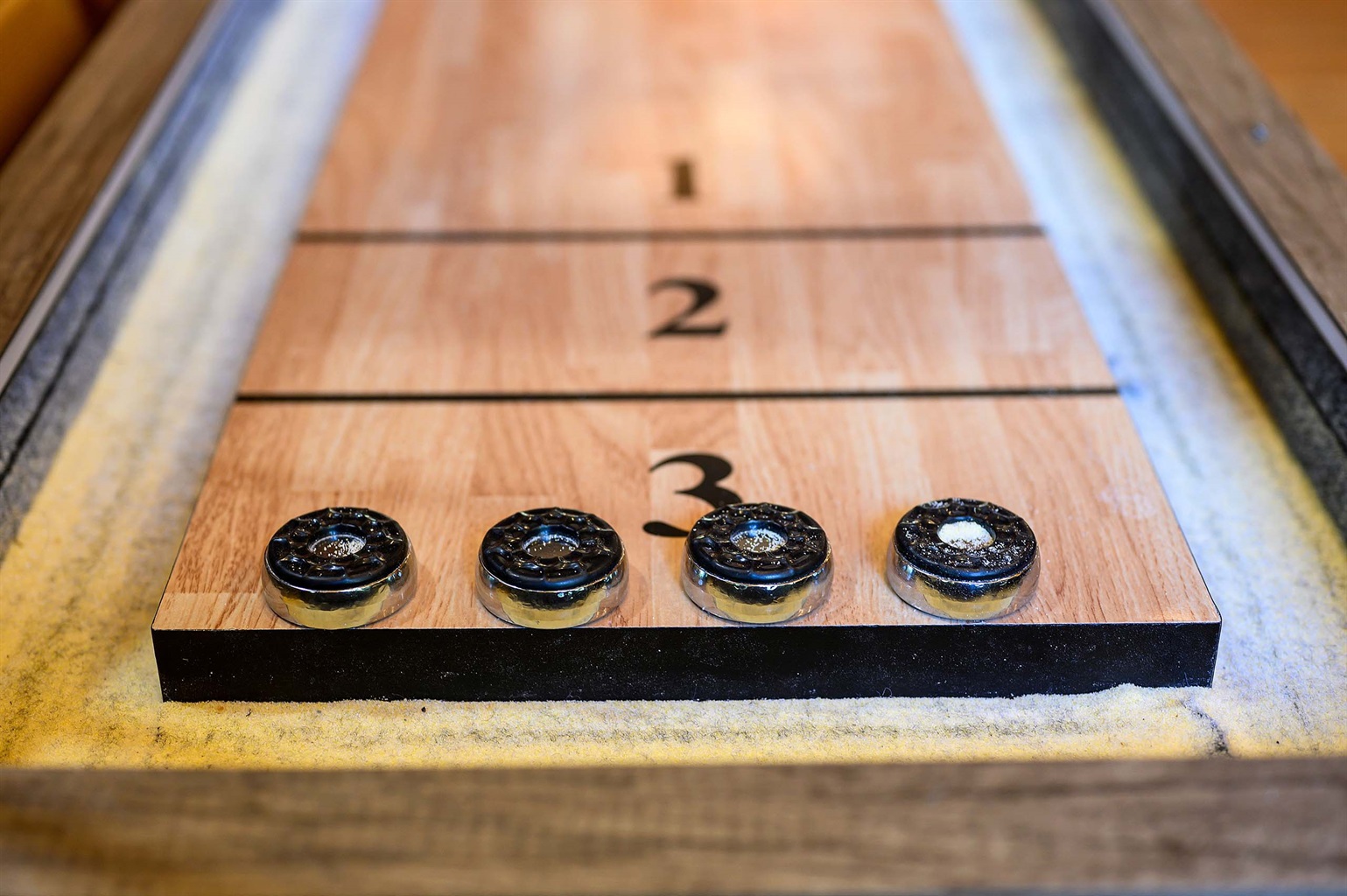 Enjoy a game of Shuffleboard fun Enjoy a game of Shuffleboard fun - Iron Horse Lodge - Broken Bow