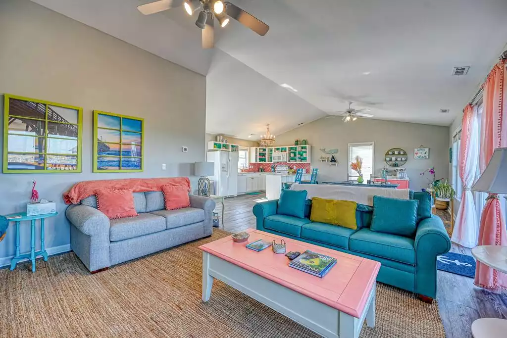 The main living area features open spaces perfect for gathering with family and friends. - Wonder the Sea:Views, Walk to Beach, Hot Tub, Pets - Surf City