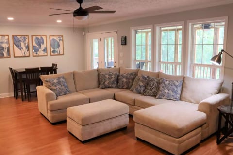 Living room faces the lake and has a large sectional sofa (with pull out bed) and Smart TV with Roku to watch subscription services.