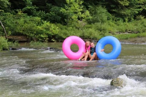 Tubing in Front of Wolf River Retreat Rental Byrdstown, TN