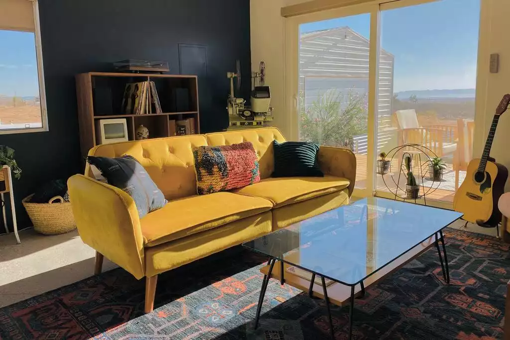 The couch is a futon that folds down to a full bed. The couch is a futon that folds down to a full bed. - The Filmmakers House - Joshua Tree
