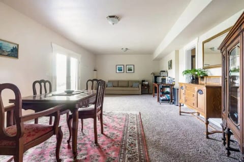 Yukon Harbor is visible from the dining area through the French doors.