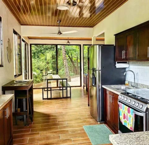 The kitchen has new stainless steel appliances: 6 burner stove, oven, and fridge