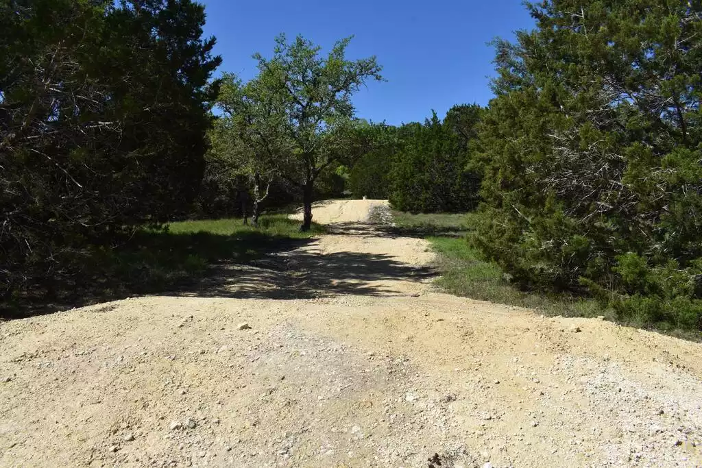 Gravel roadway through the property- only accessible by rental of UTV and walking. - GWR-Private-AmazingHilltopView-HotTub-FirePit-Pool - Fredericksburg