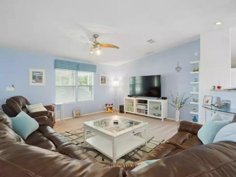 Living area with 65 inch HDTV, Bose cinema sound, upgraded cable and Netflix