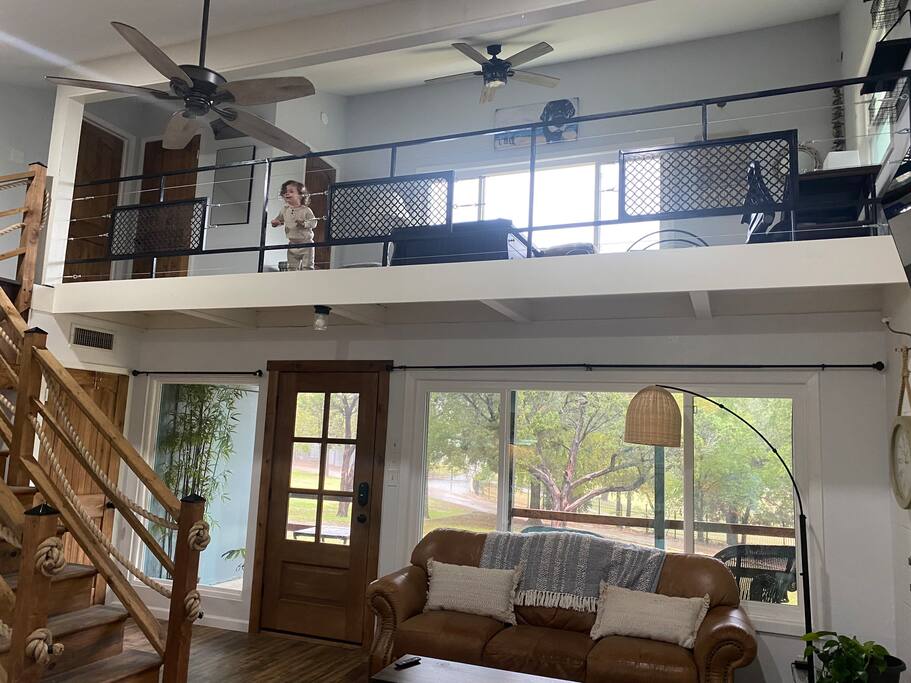 view of loft/game room and living room from kitchen - Magnolia Lakehouse - Clifton