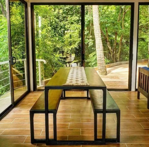 8-person dining seating with all glass doors that look out into our backyard