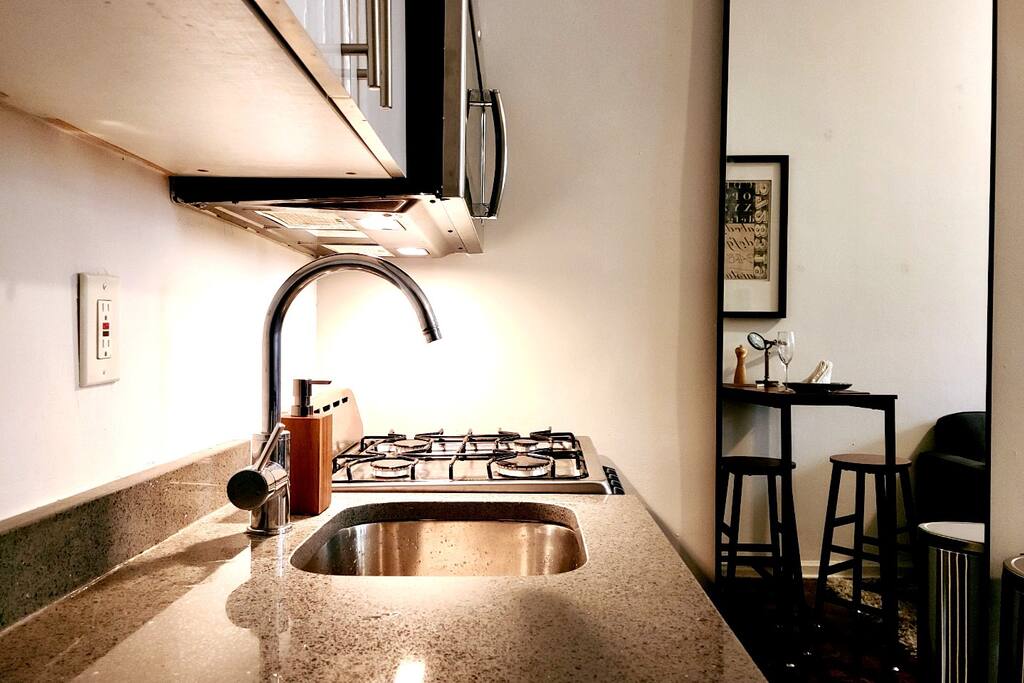 The countertop is granite, the appliances are new (Summer 2022). And the apartment has a dishwasher. It may sound silly, but that's a luxury amenity in NYC. - Stylish East Village Studio - New York